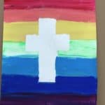 tape resist cross on rainbow background