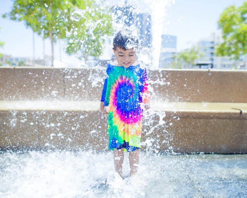 child in a fountain