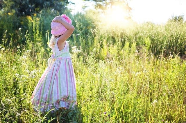 little girl in a field