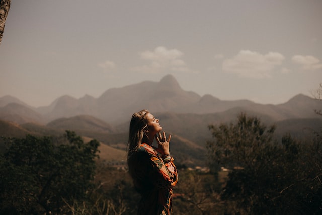 woman praying outdoors