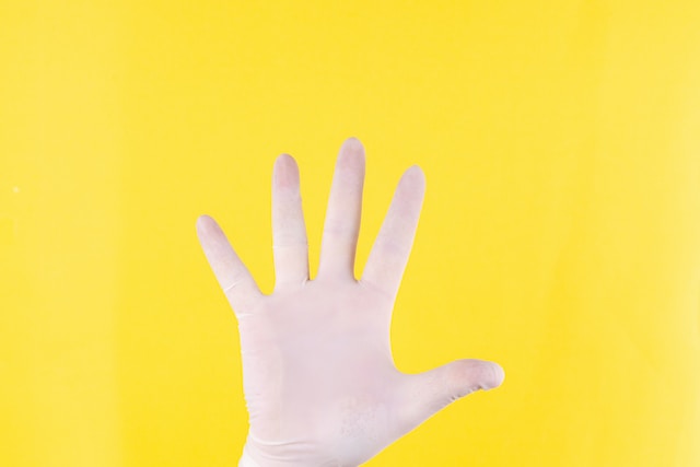five fingers on a yellow background