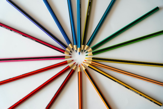 coloring pencils forming a heart